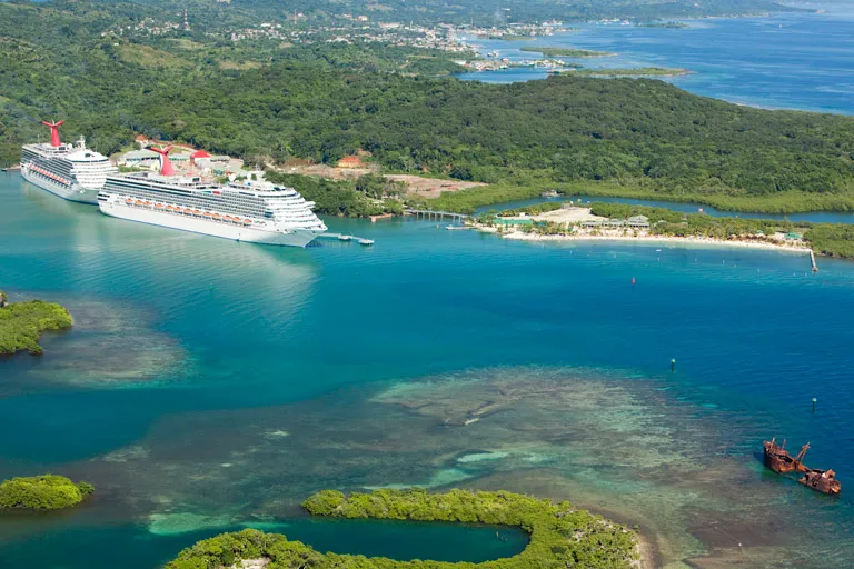 Two cruise ships docked at Mahogany Bay, Roatan — the starting point for most Roatan Honduras excursions